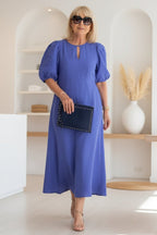 Maxi dress with puff sleeves and tailored fit